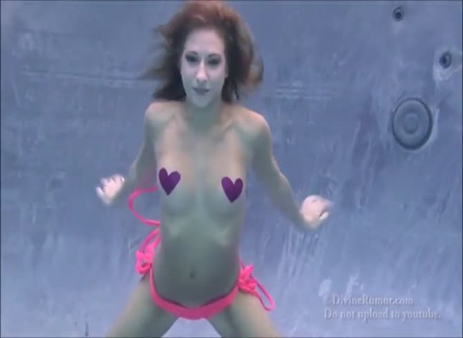 Video :Wild horny babe looks hot getting naked under water